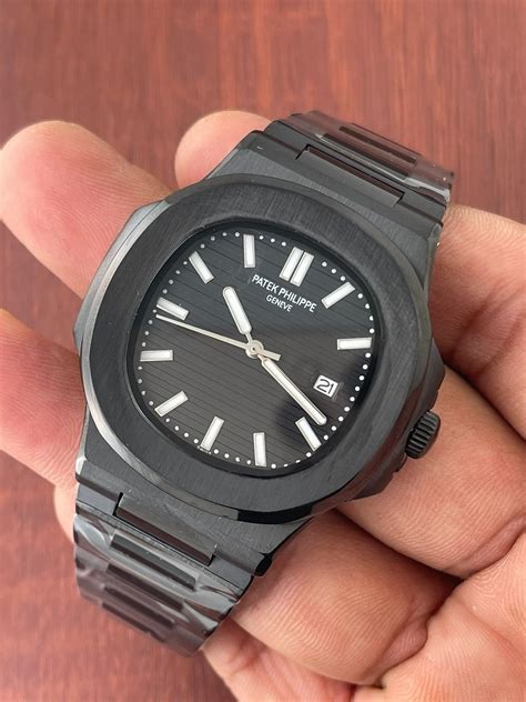 black patek philippe nautilus black face arabic numbers|Patek Philippe watch price.